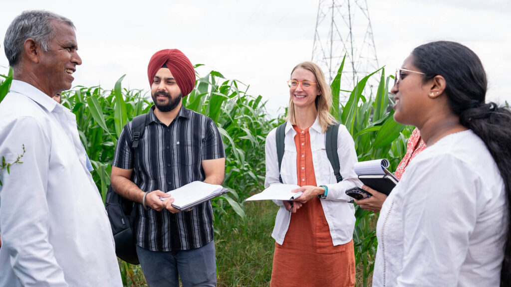 A farmer with the Kheyti program in India meets with the Autodesk team.