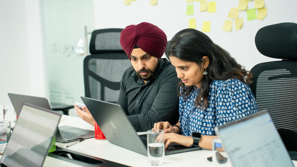 Autodesk team members at work at their laptops helping Kheyti scale.