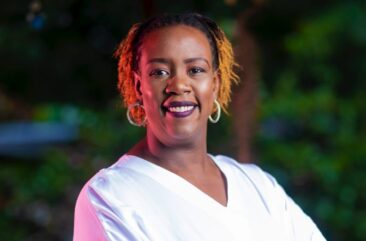 Portrait photo of Wanjiru Kamau-Rutenberg, Executive in Residence, Schmidt Futures, and member of the Autodesk Foundation Board of Directors—wearing white v-neck shirt and smiling.