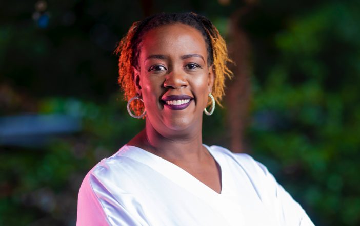 Portrait photo of Wanjiru Kamau-Rutenberg, Executive in Residence, Schmidt Futures, and member of the Autodesk Foundation Board of Directors—wearing white v-neck shirt and smiling.