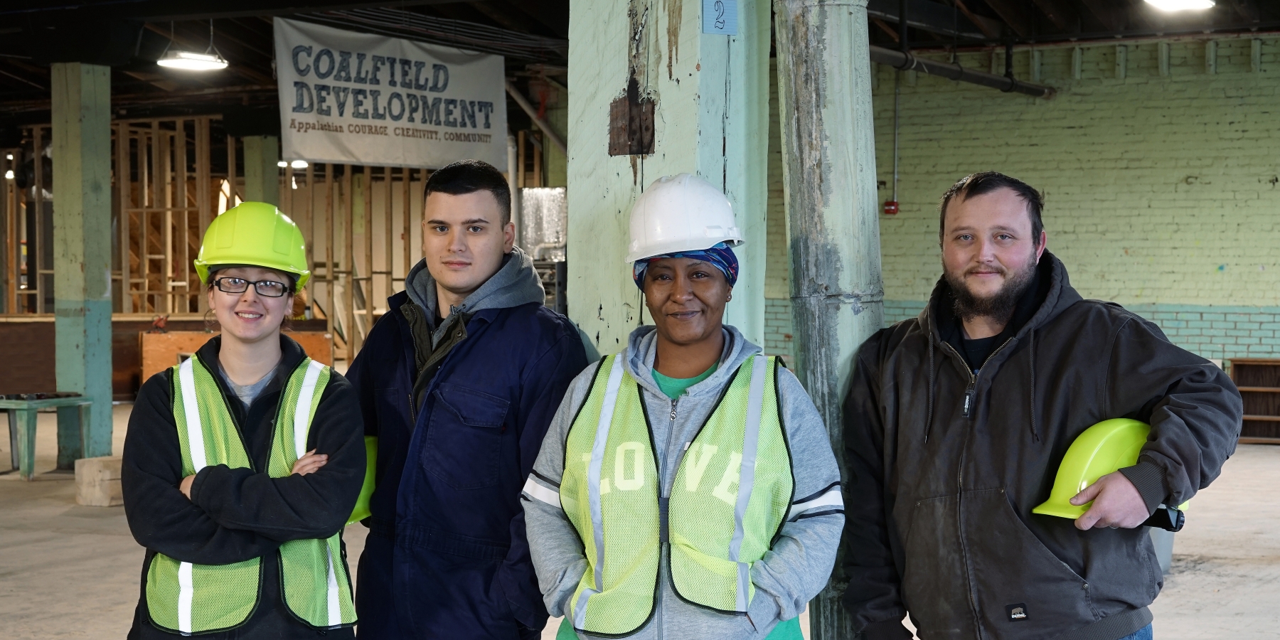 Workers pose at Coalfield Development factory