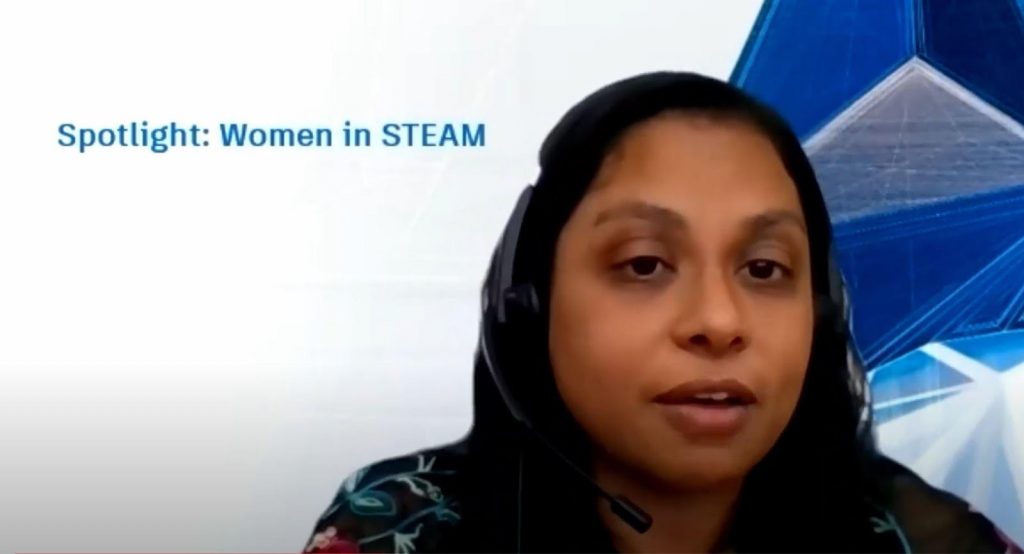 A woman with headset, from a Zoom meeting
