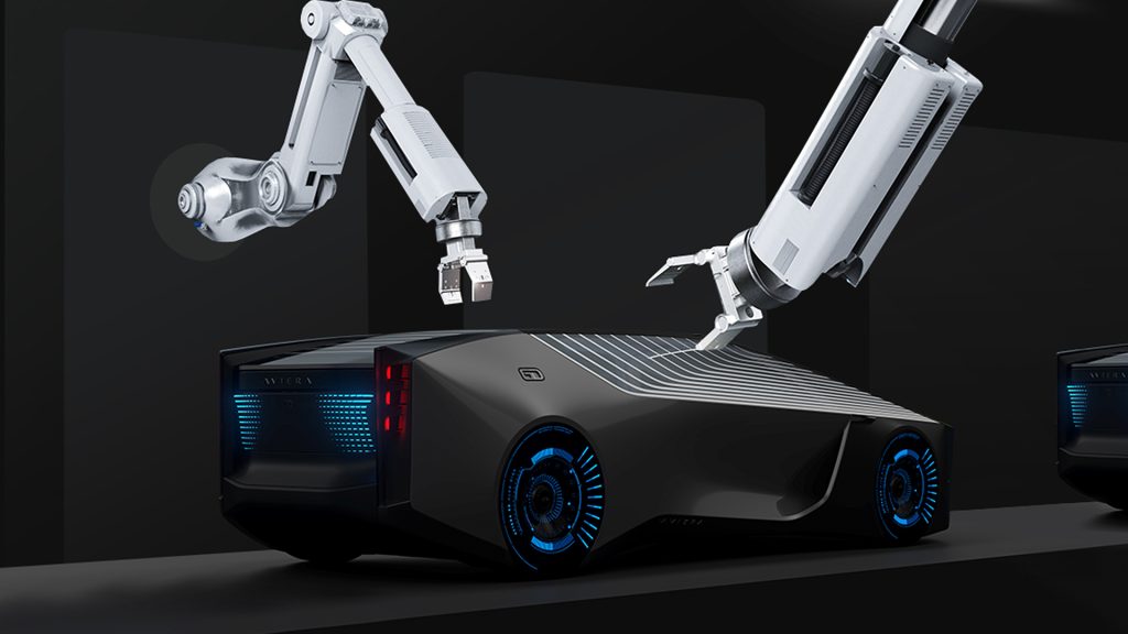 Automotive Innovation Forum event image. Image of a futuristic black car with white lines on its roof. There don't seem to be any windows. The car's wheels and trunk have blue detailing. There are two robotic arms above the car, with their claws open.