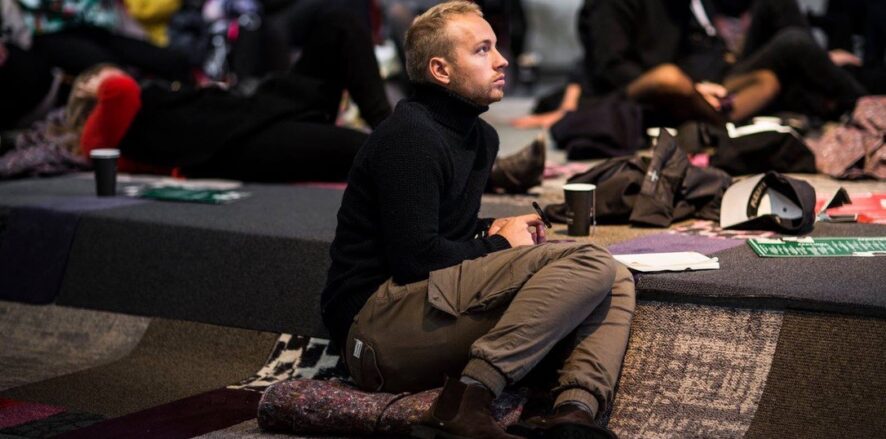 Architecture student paying attention at a conference