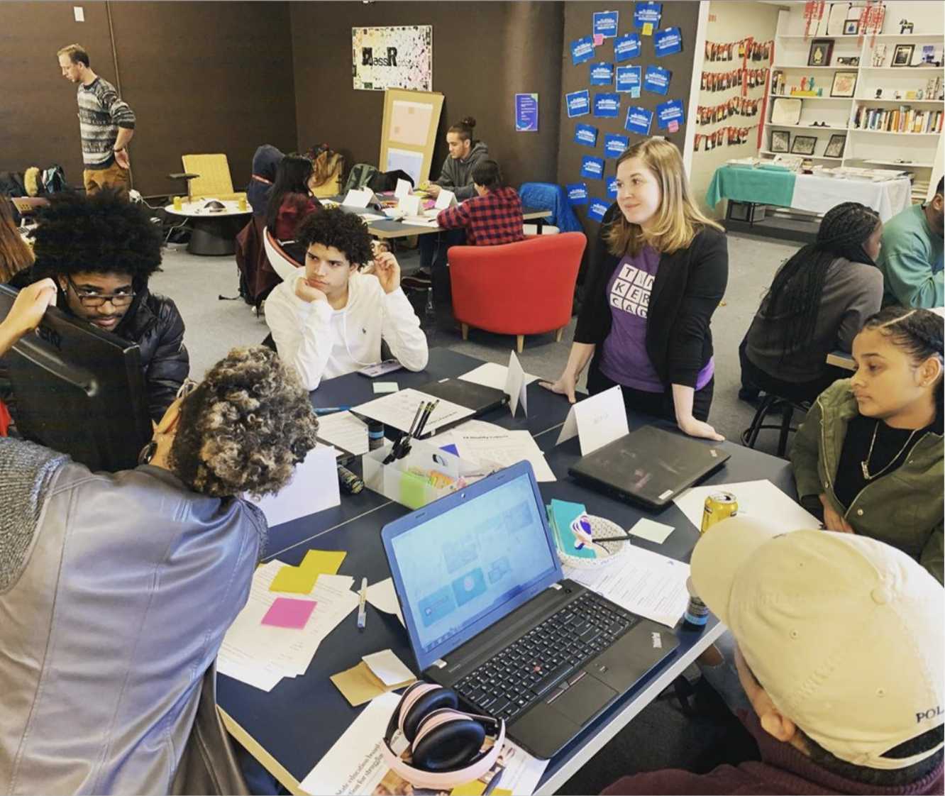 High school students in a classroom working in groups.