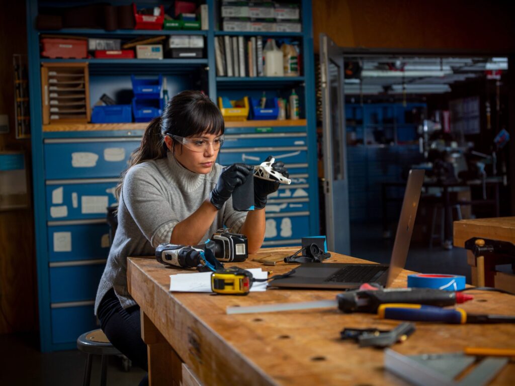 Woman working with a generatively designed part at the Autodesk San Francisco Technology Center.