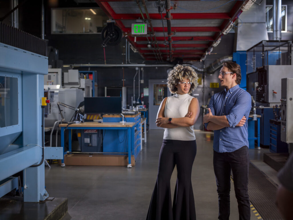 Man and woman during tour of the CNC machine shop at the Autodesk San Francisco Technology Center