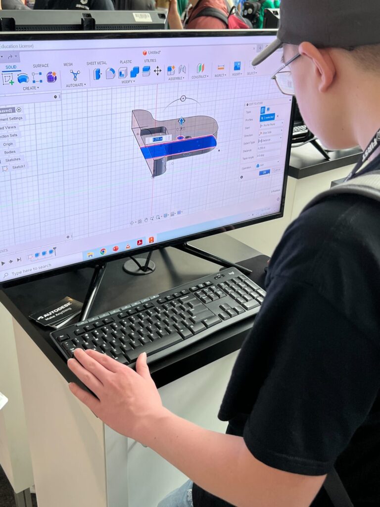 student on computer using Fusion 360