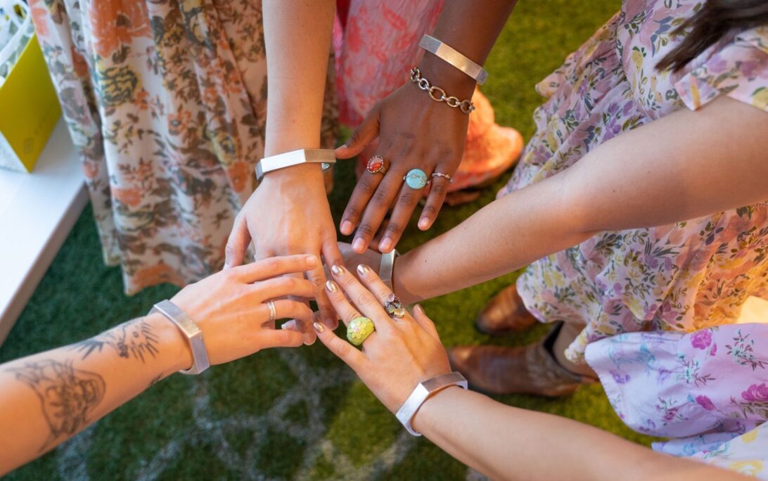 Students model their bracelet designs