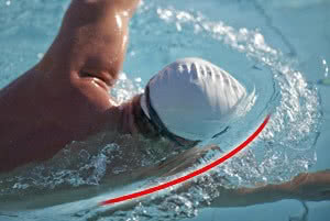 swimmer with illustrative line showing the wave top